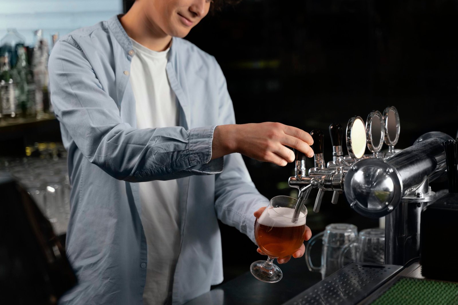 close-up-man-pouring-beer-glass